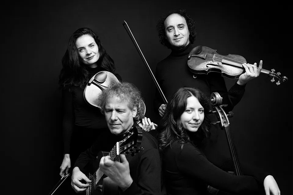 The same close group portrait in black and white