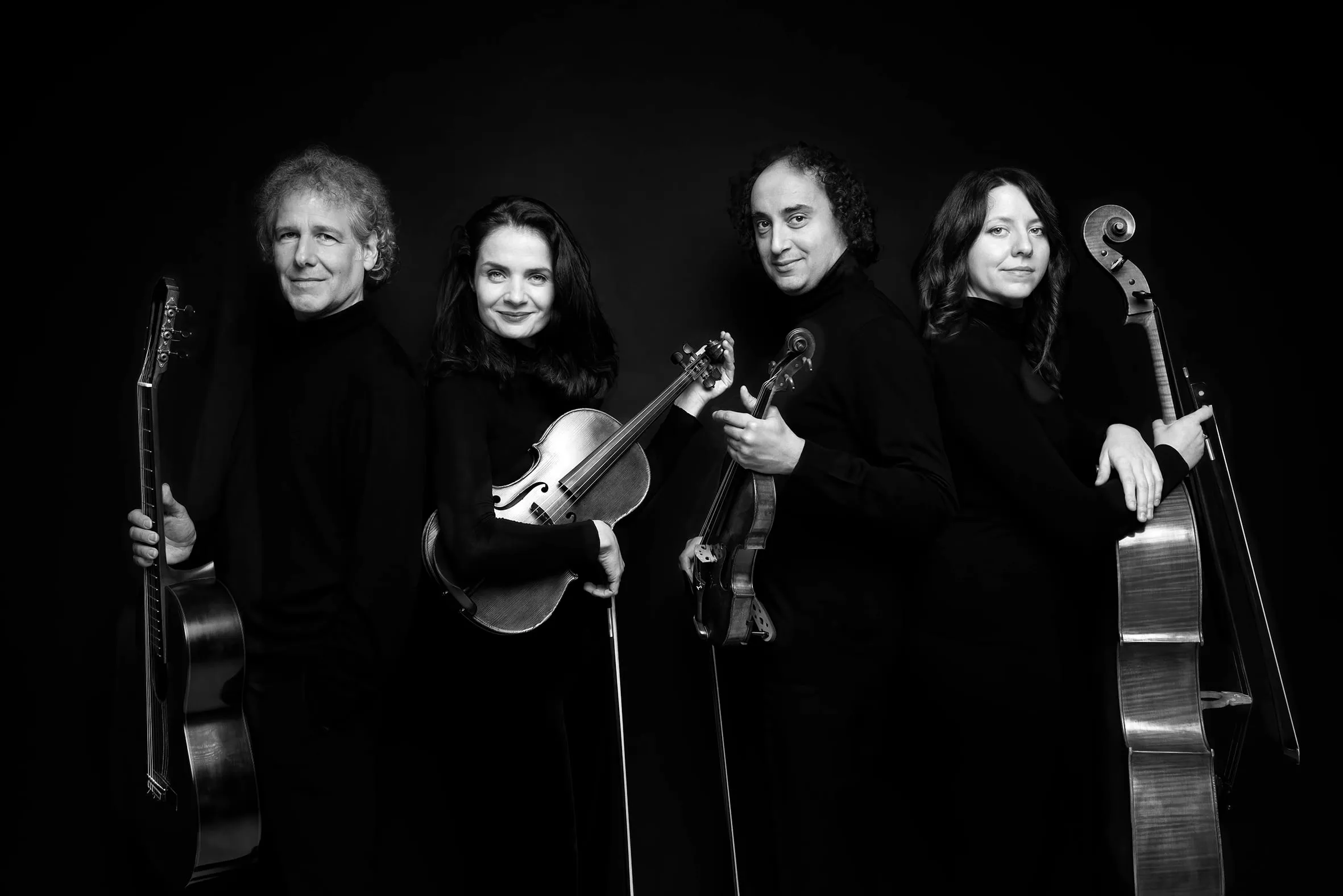 The same angled group portrait in black and white